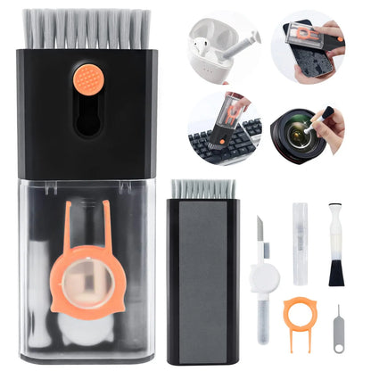 The black case with all twenty-two tools laid out beside it, including the keycap puller, lens pen and earbud-case heads